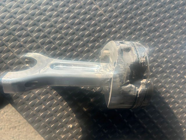 The connecting rod and piston - the rod melted beyond use